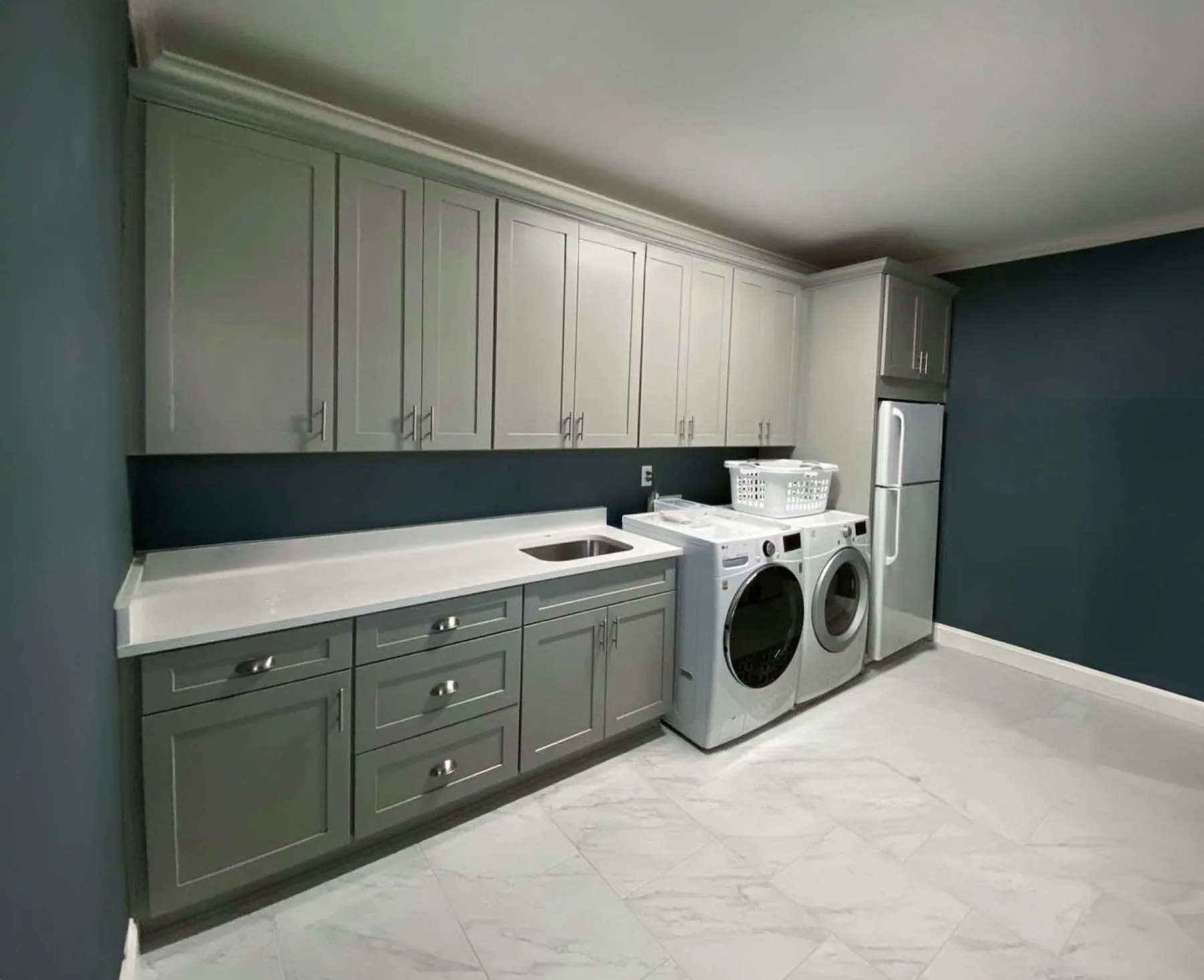 Laundry room with gray custom cabinets