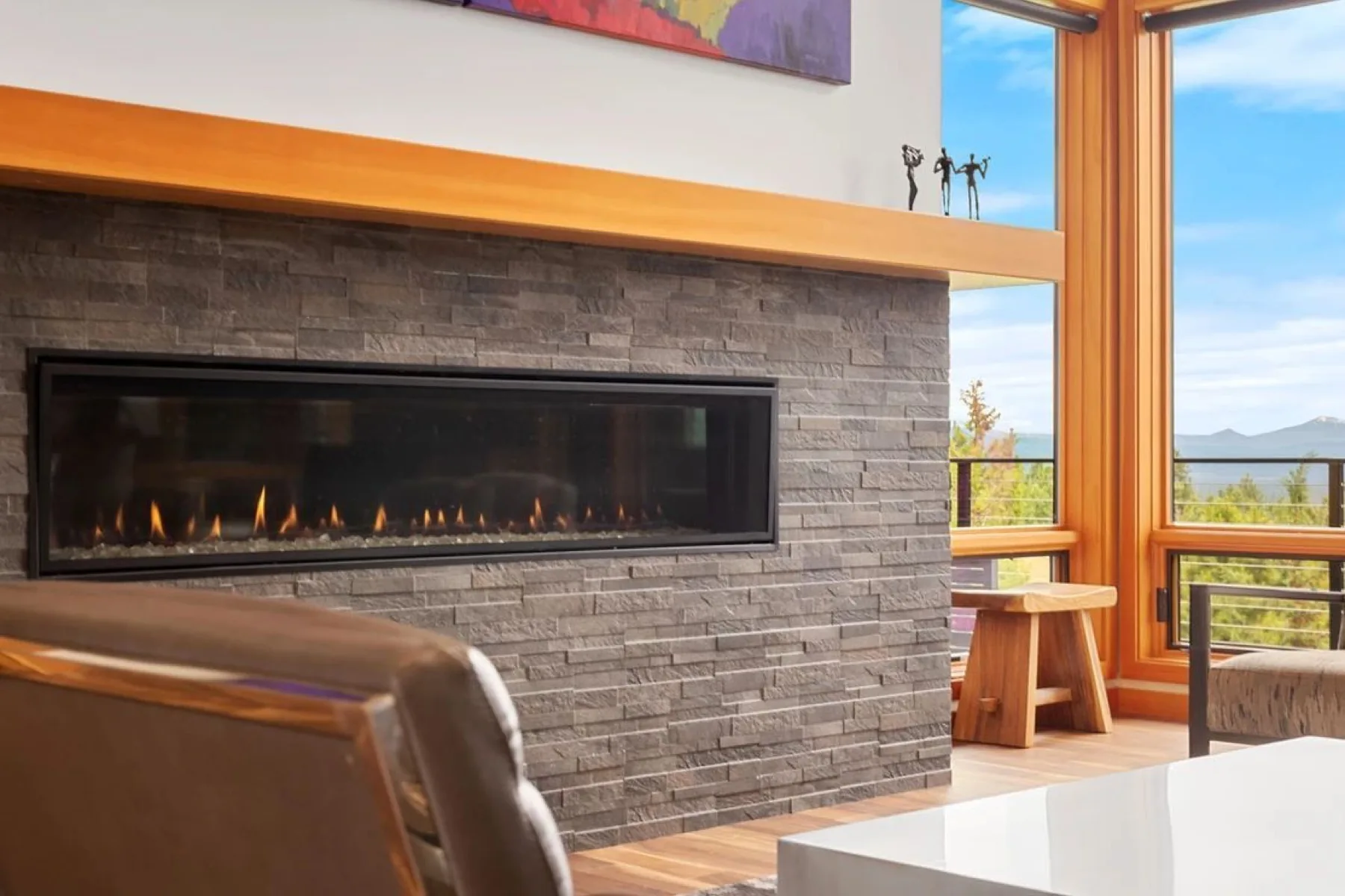 Stone fireplace with custom wooden mantel